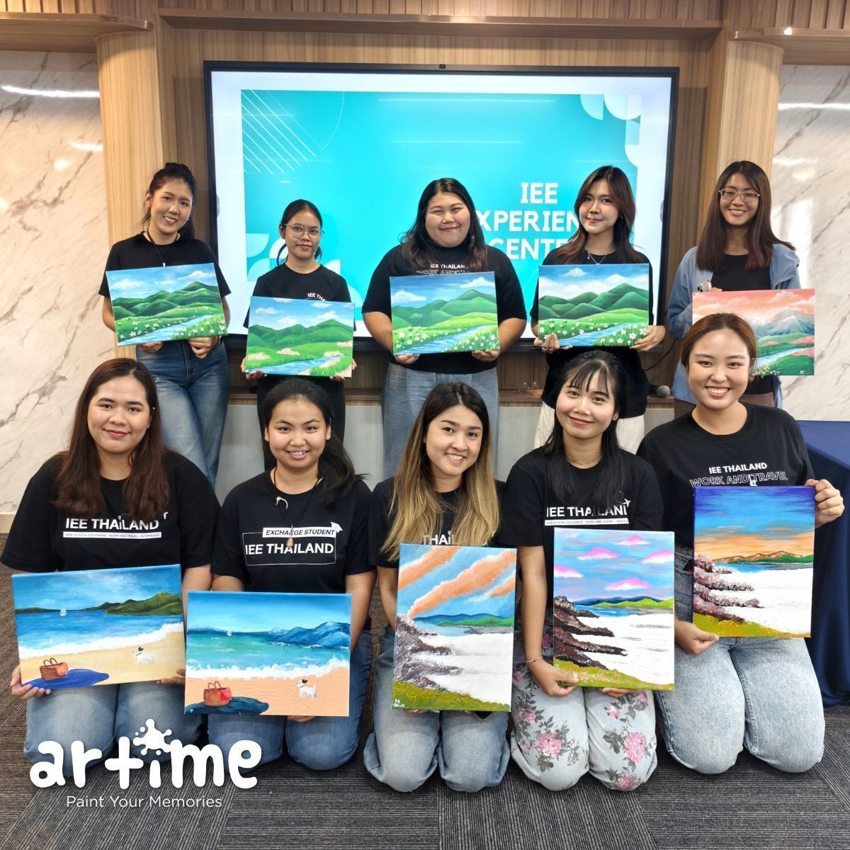 IEE Thailand corporate team with finished paintings at Artime Bangkok workshop / ทีมองค์กรพร้อมผลงานเสร็จที่ Artime ลาดพร้าว